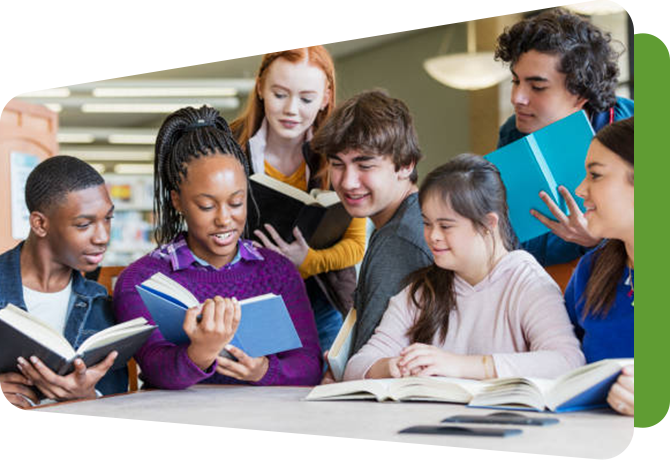 group of students gathered together holding open books