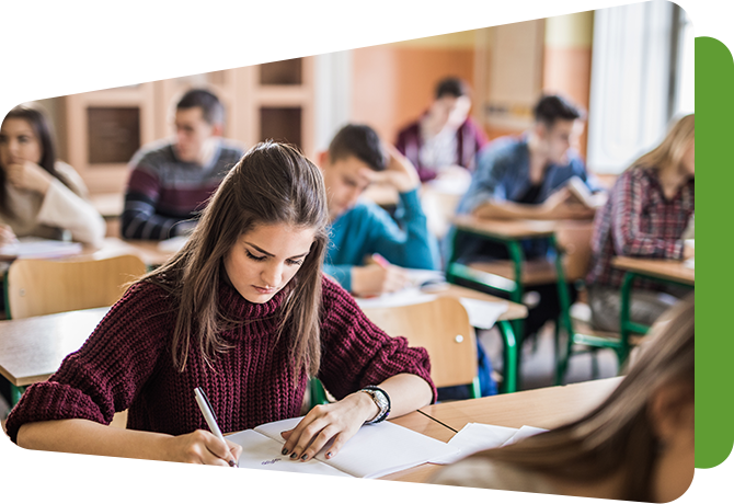 classroom of students writing at desks