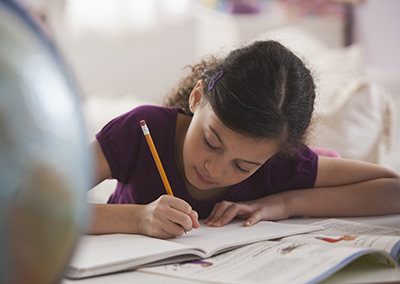 Girl writing in a notebook