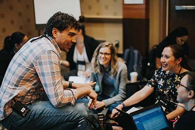 conference attendees chatting in a small group