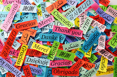 pieces of colorful paper with the word "thank you" written in several languages