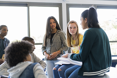 group of students in classroom having a discussion