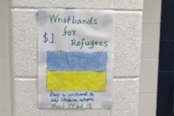 Poster with Ukrainian flag titled Wristbands for Refugees