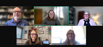 Screenshot of a Zoom meeting with five people smiling.