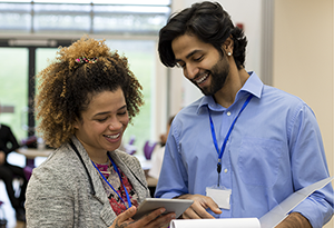 two teachers looking at a padlet together