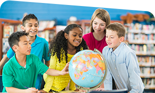 photo of young students around a globe