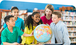 young students gathered around a globe