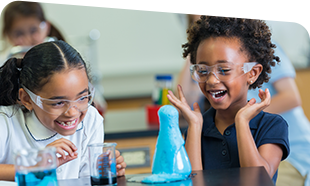 two younger students at science lab table