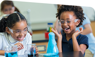 two young students doing a science experiment