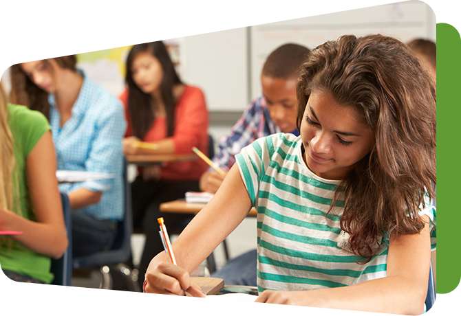 older students reading and writing at desks